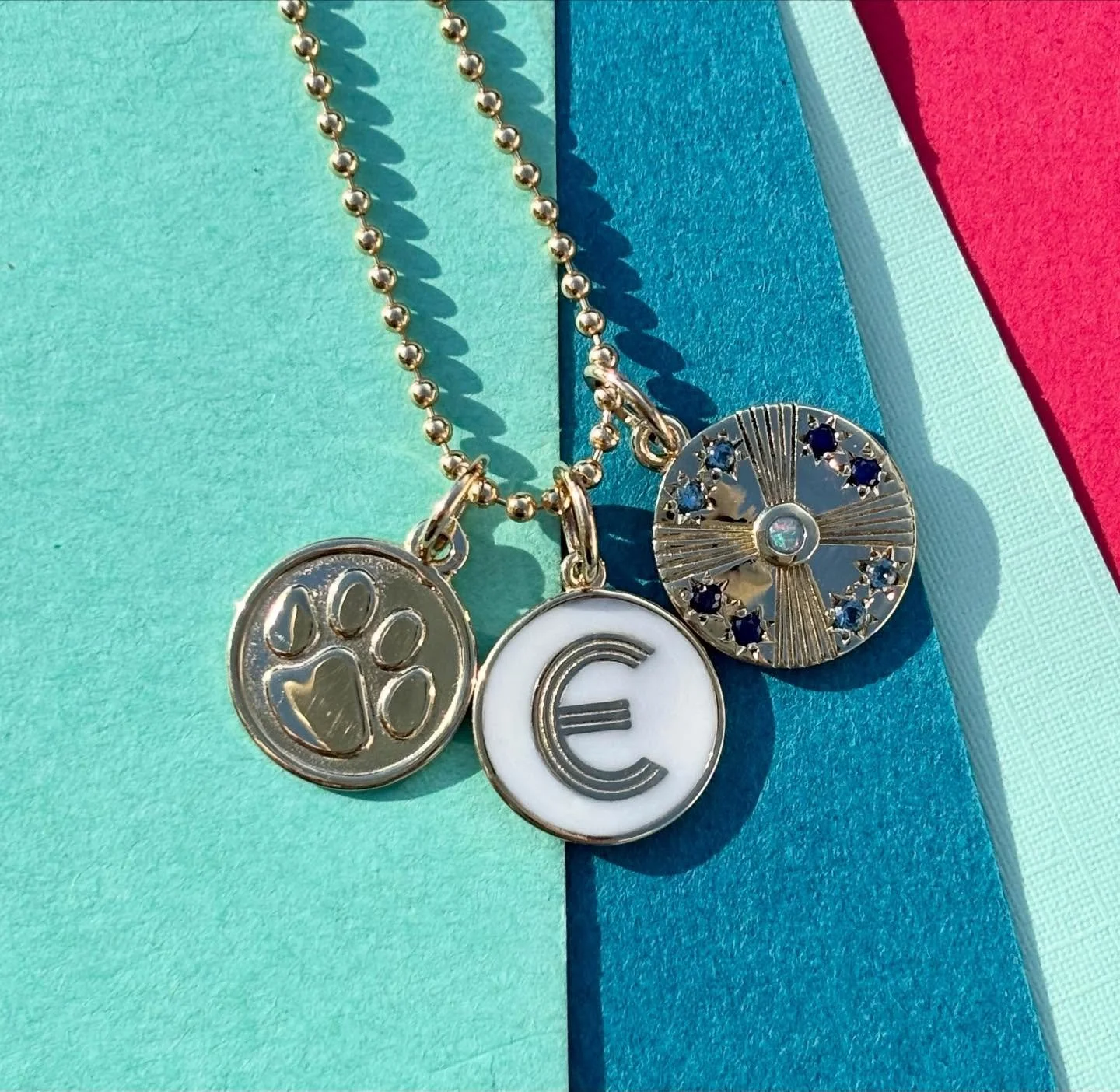 For the mini me - small charms with big impact. ✨ puppy paw print charm, mini art deco initial and the mini birthstone disc. All good for mom or daughter! 🩵