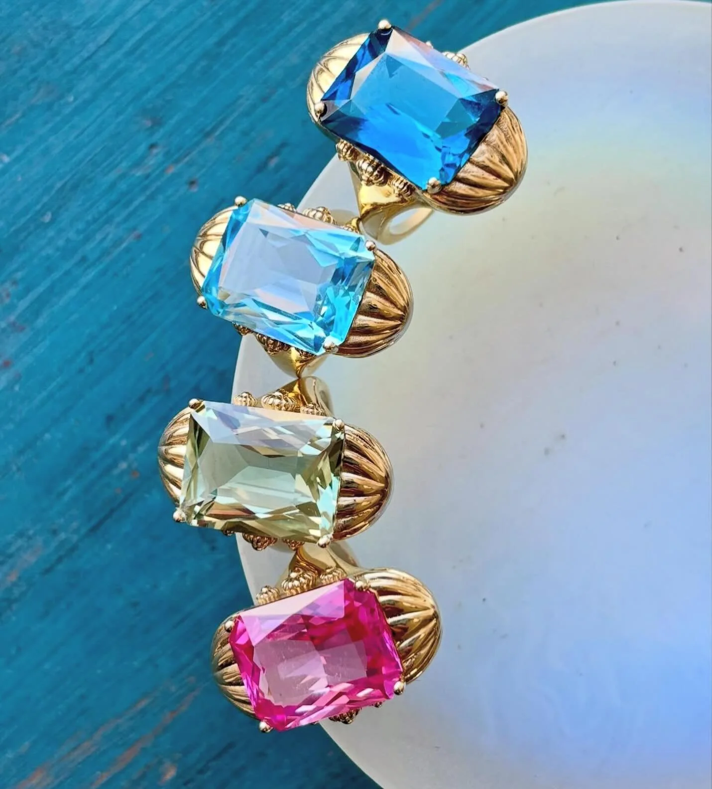 For the glamour girl- our FOB cocktail rings feature scissor-cut semi precious stones for a big look with maximum impact ✨ from top: London blue topaz, sky blue topaz, green amethyst and pink topaz