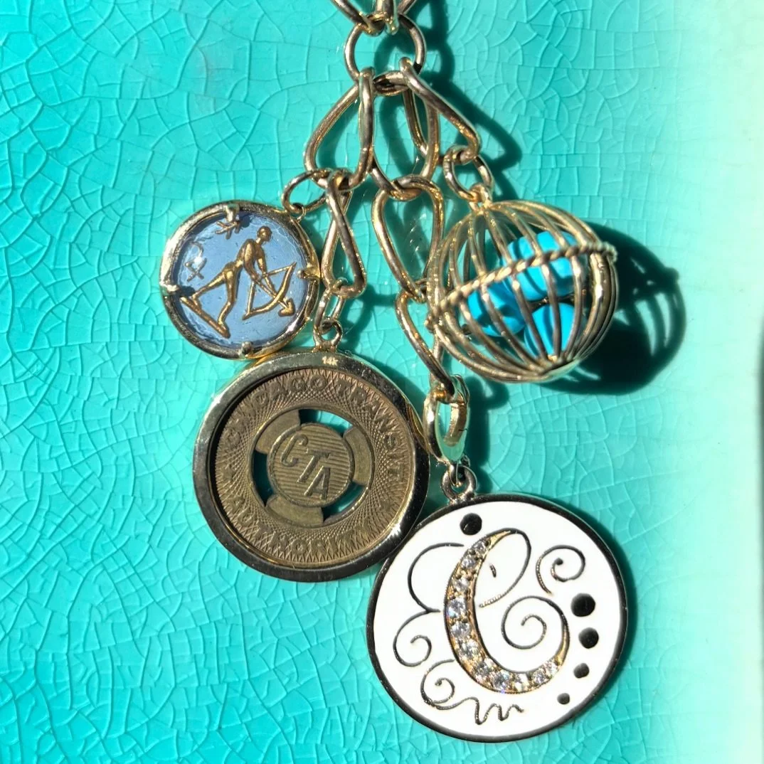 Loving this Netherfield combo: vintage initial in white enamel, vintage Chicago CTA token, vintage zodiac and our cage filled with turquoise. 🩵
