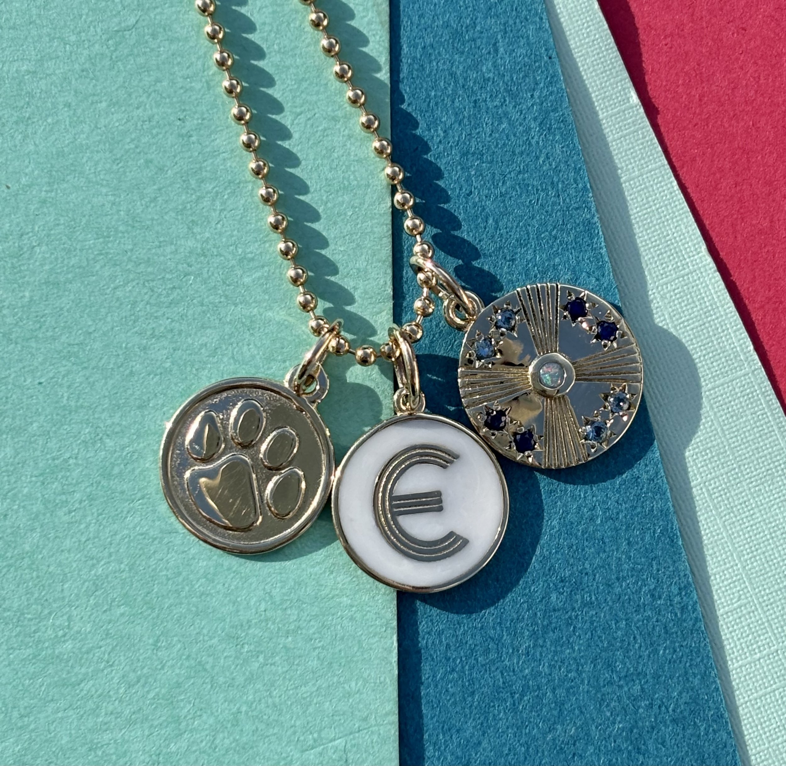 Netherfield mini art deco initial with birthstone disc and paw.jpeg