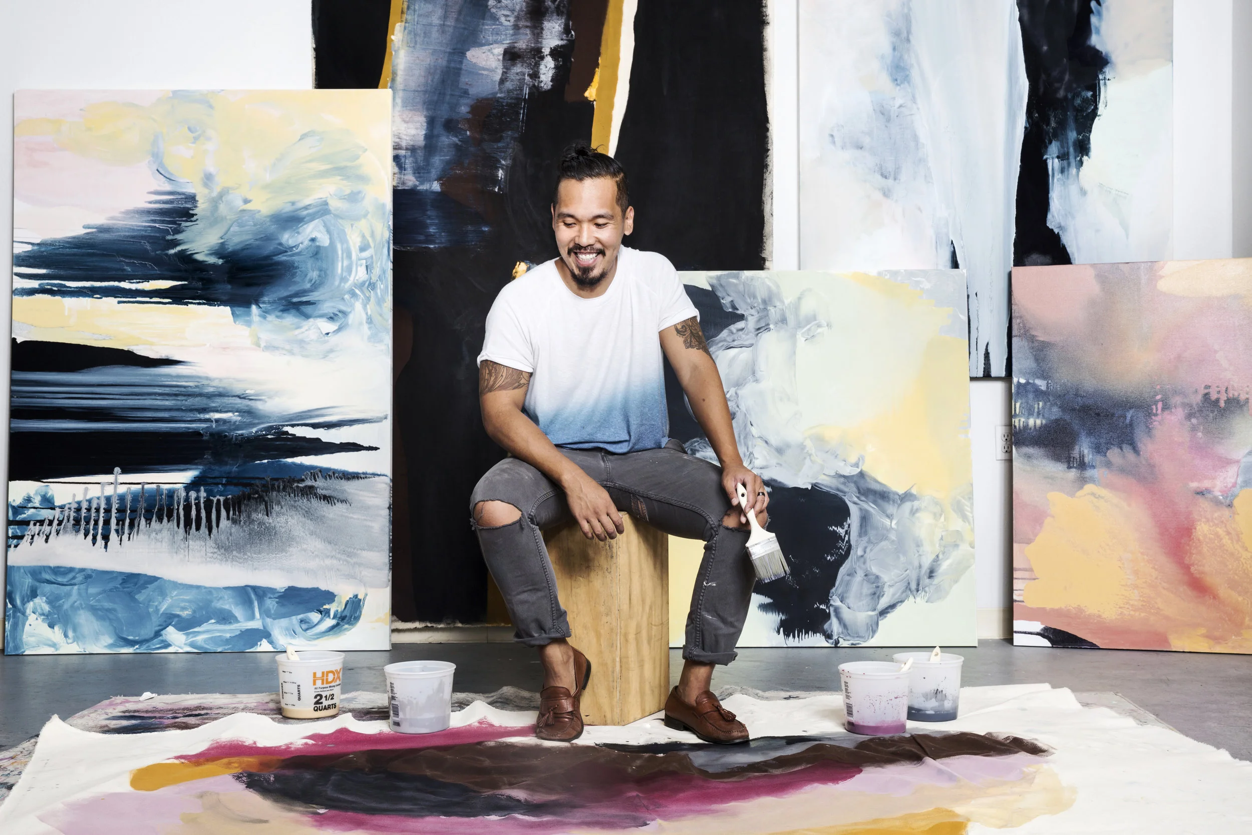 DodieSy_WithPaintings.jpg