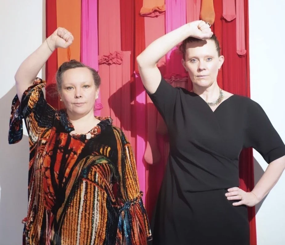  Eirún and Jóní paying endurance tribute to feminists, taking up the solidarity pose of Gloria Steinem and Dorothy Pitman Hughes 