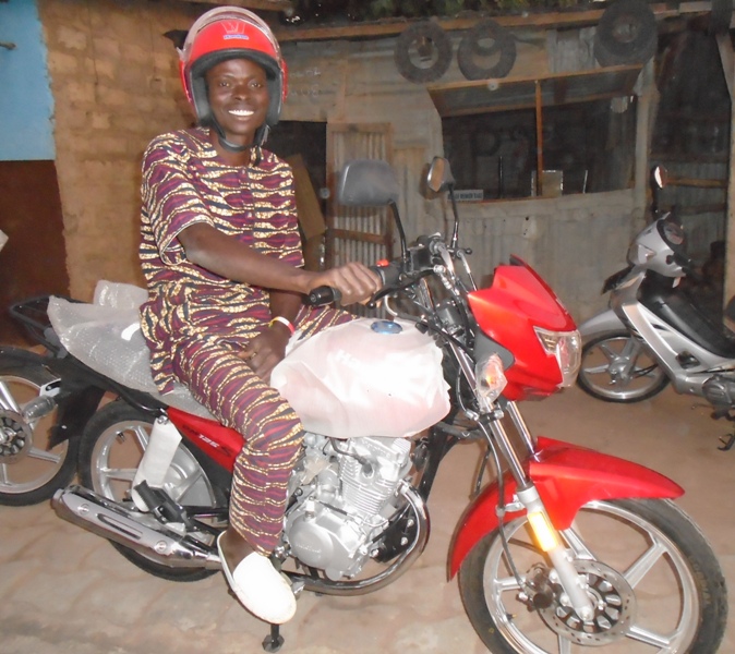 Pastor Paul Dousoumon on His New  Motorbike.JPG