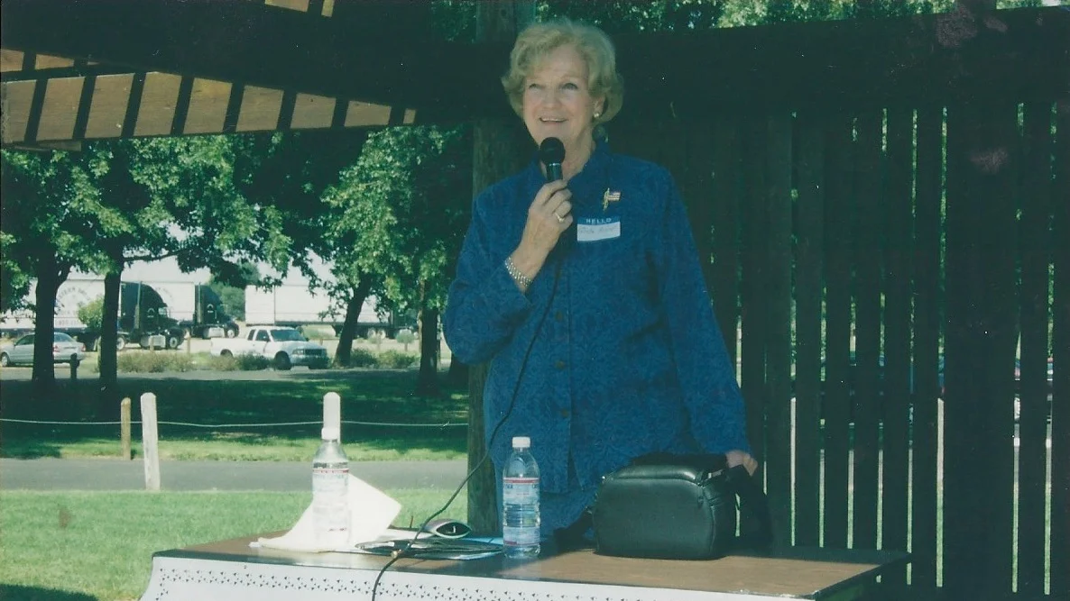 Greta Nord speaking at a job fair.