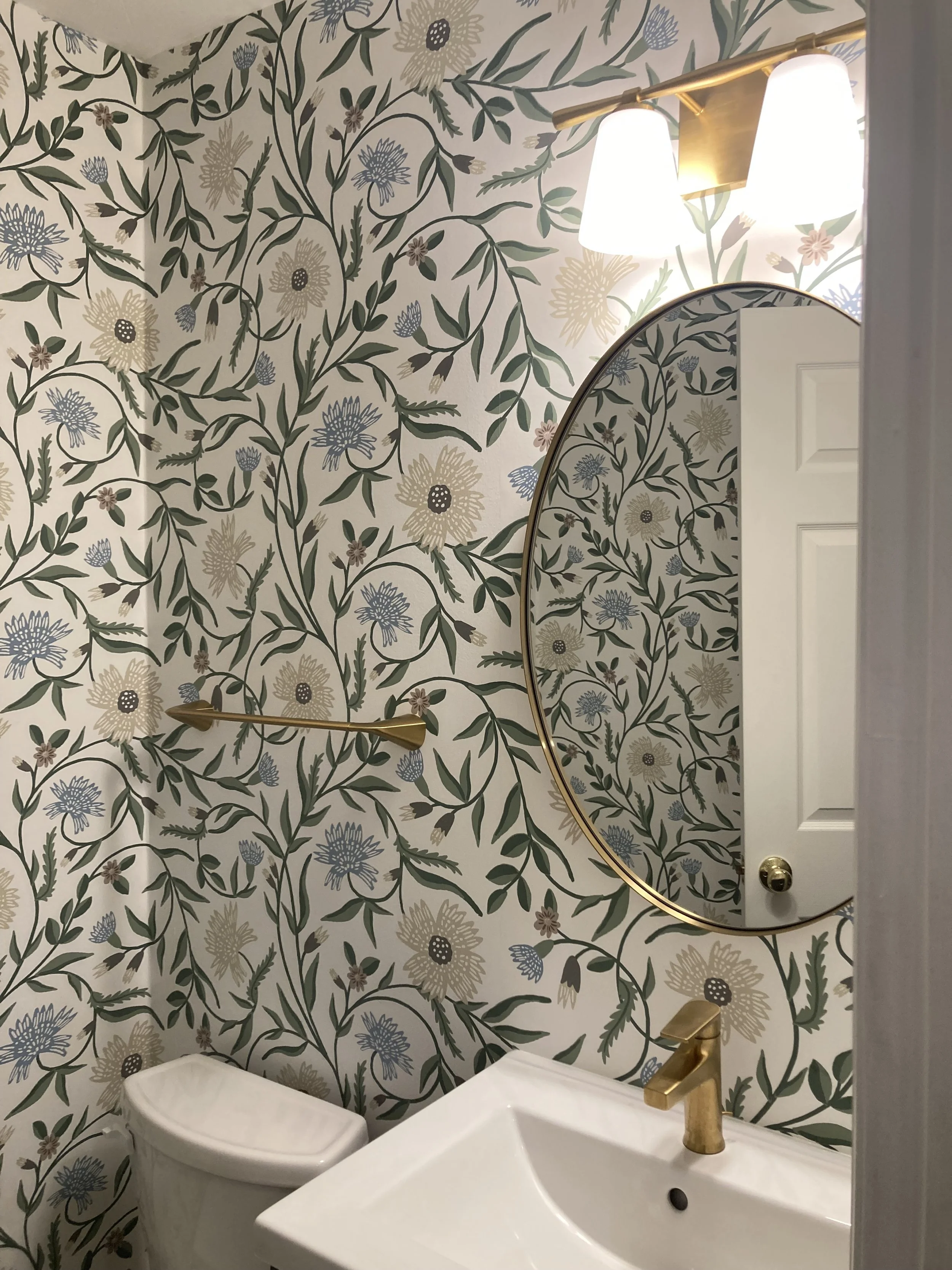 yA small bathroom upgrade - wall paper, new vanity and light fixture