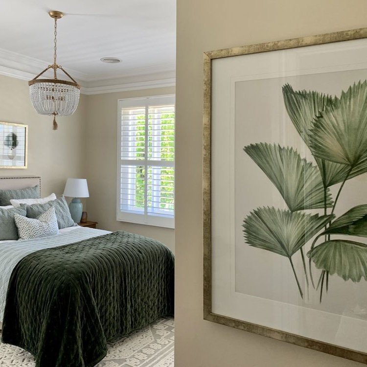 Artwork at the entry of a green bedroom designed by Hue and Space Interior Design