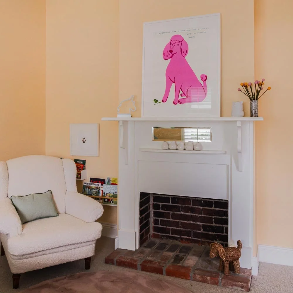 A cosy corner that feels warm, calm and beautifully considered. 

Soft peach walls, a plush boucle armchair and our client's striking pink artwork create a space that&rsquo;s inviting, layered and full of character.

It&rsquo;s a lovely reminder that