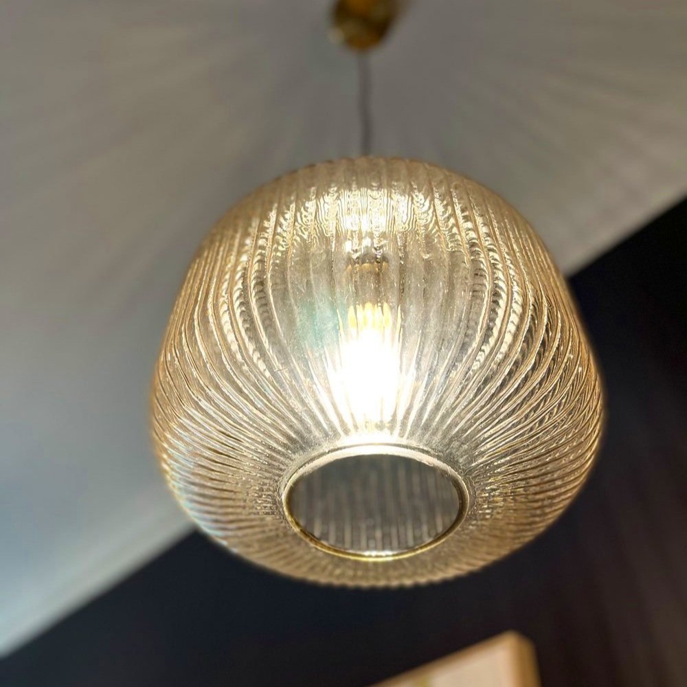 Hand blown glass pendant lights in a warm colour by Hue and Space Interior Design