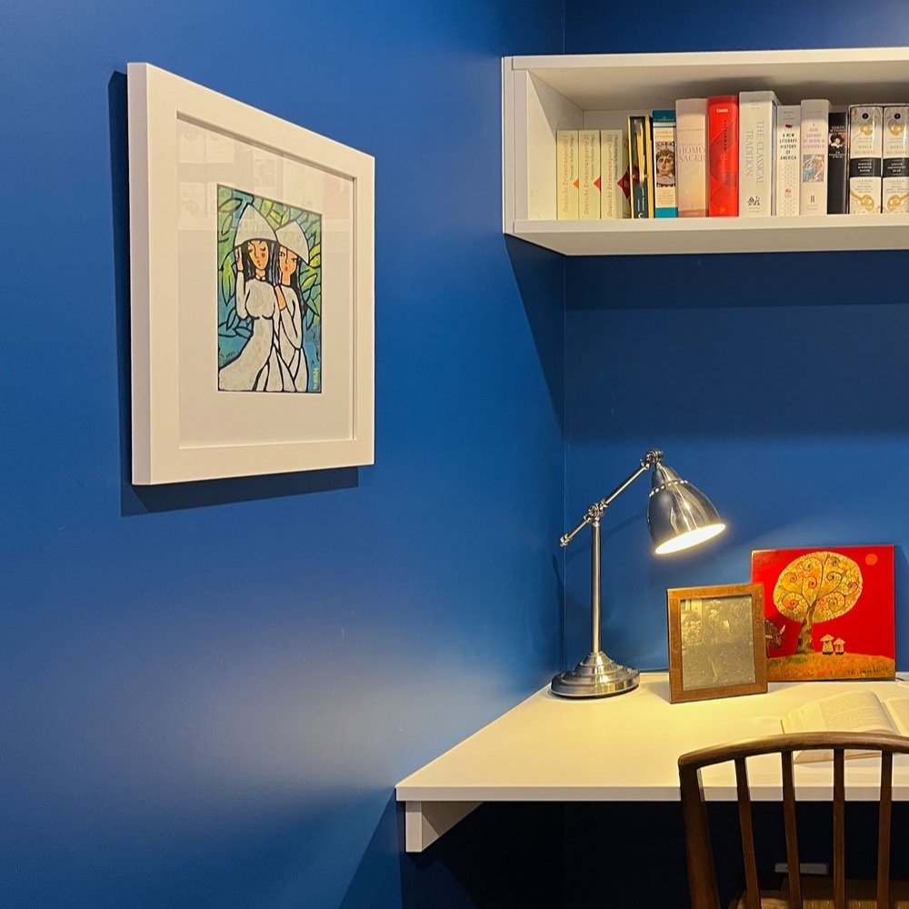 Bright blue walls and white custom joinery in the small home office designed by Hue and Space