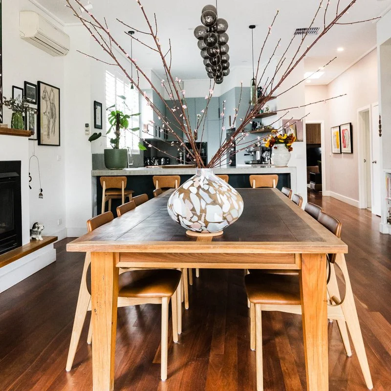Dining Room with large table and decorative vase