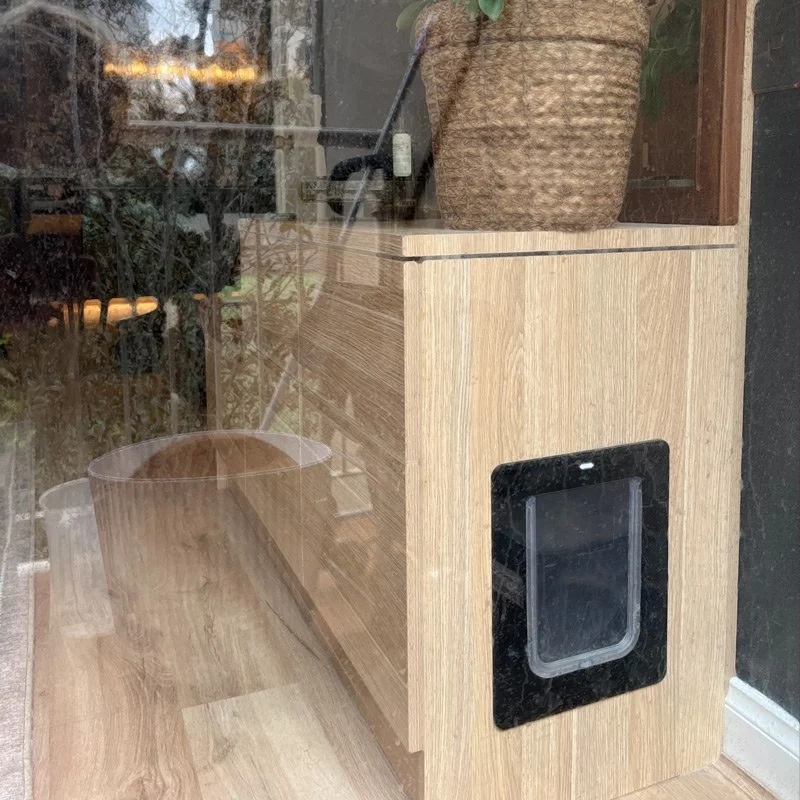 Showing the cat door exit and entrance to kitty litter at side of custom joinery