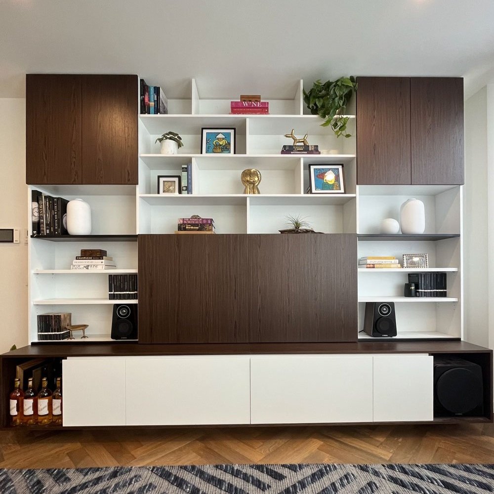 Living room joinery that hides a TV designed by Hue and Space Interior Design