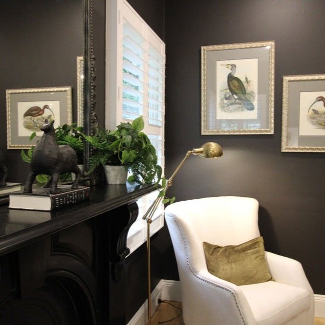 Dark bedroom walls with olive bedhead and pink rug designed by Hue and Space Interior Design