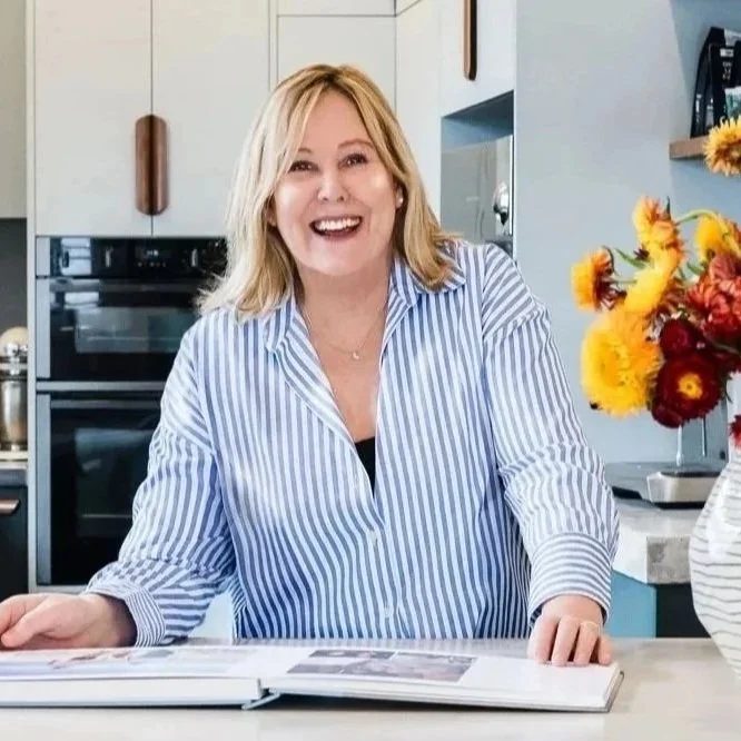 Jan Lynch at Hue and Space smiling in a kitchen she designed