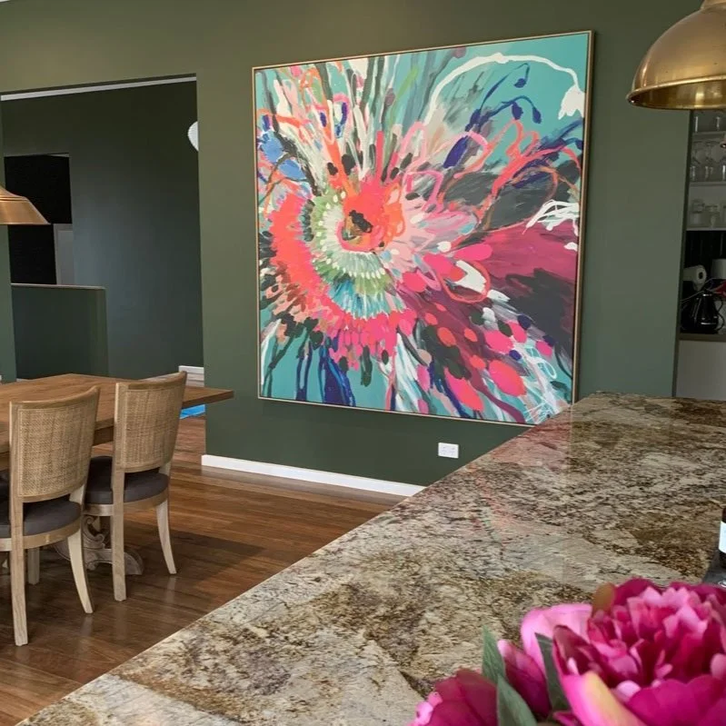 Large bright artwork brings a dining space to life