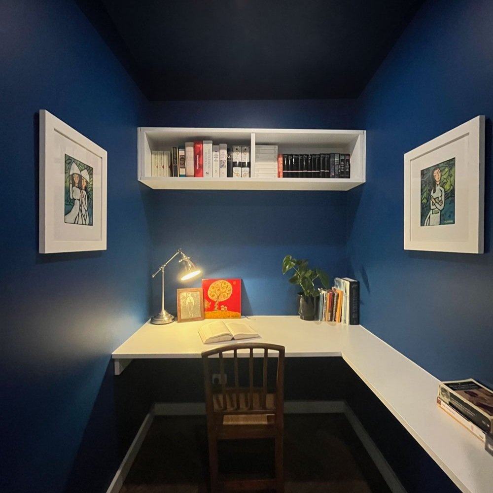 White custom home office joinery contrast against bright blue walls in this home office designed by Hue and Space Interior Design North Melbourne