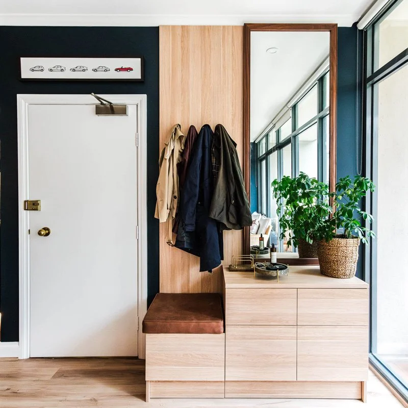 Custom joinery that serves as storage and a place to hide the kitty litter