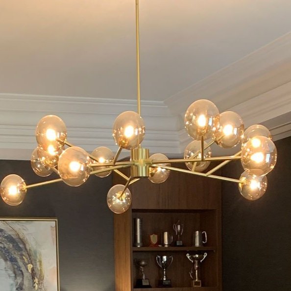 Large brass and amber glass pendant light in home office design by Hue and Space Interior Design