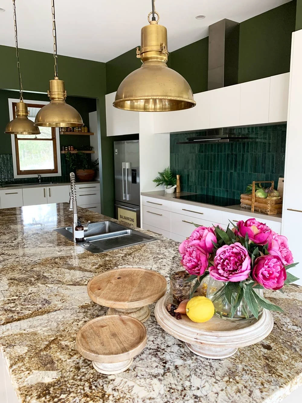 kitchen bench with pink flowers brass pendant overhead