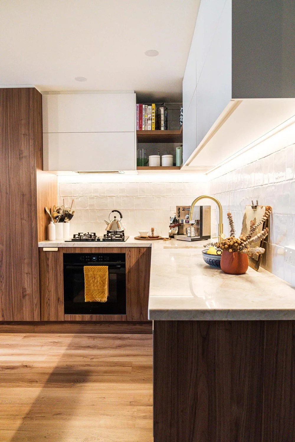 kitchen with walnut panels and stone counter tops