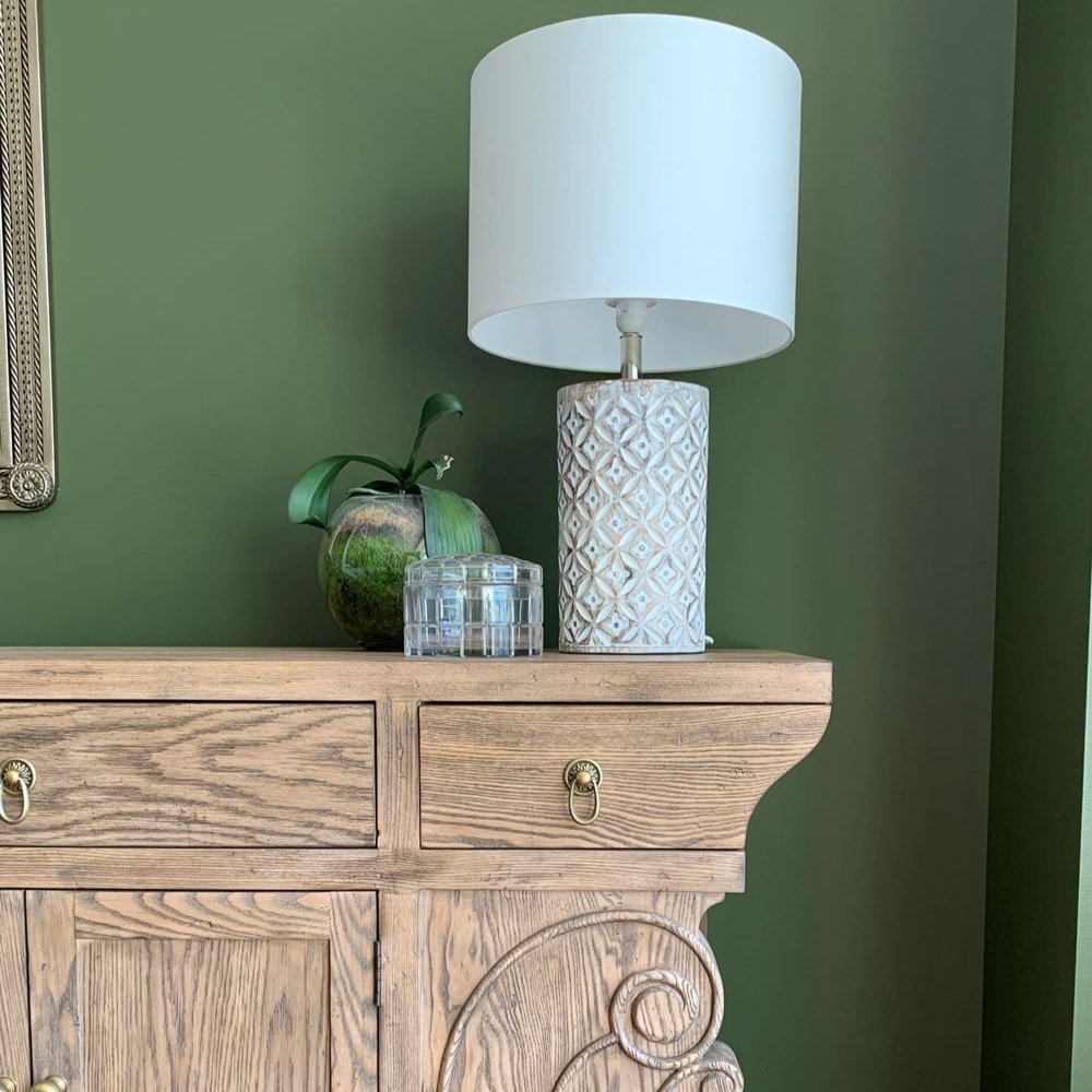 Green walls with timber sideboard and lamp dining room makeover designed by Hue and Space Interior Design