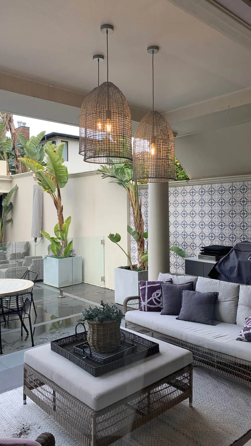 Out door patio with tiled wall and pendant lights