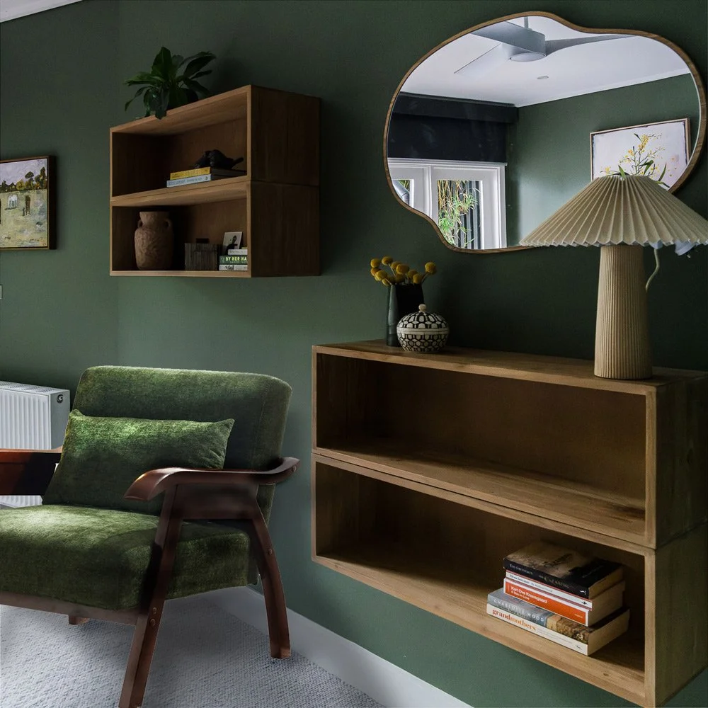 Green chair against green bedroom wall