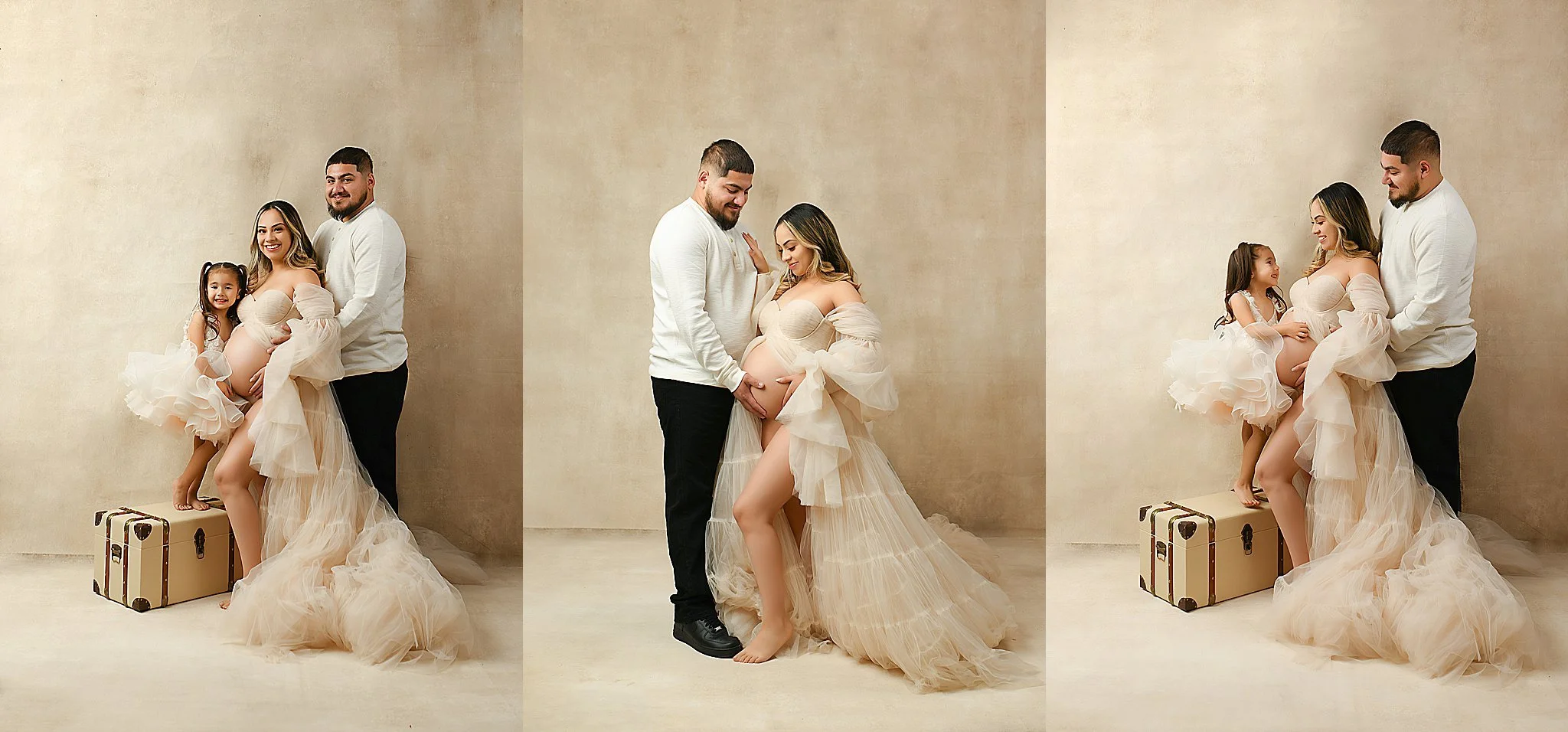 Family of three during their maternity family session with matching dresses in the studio