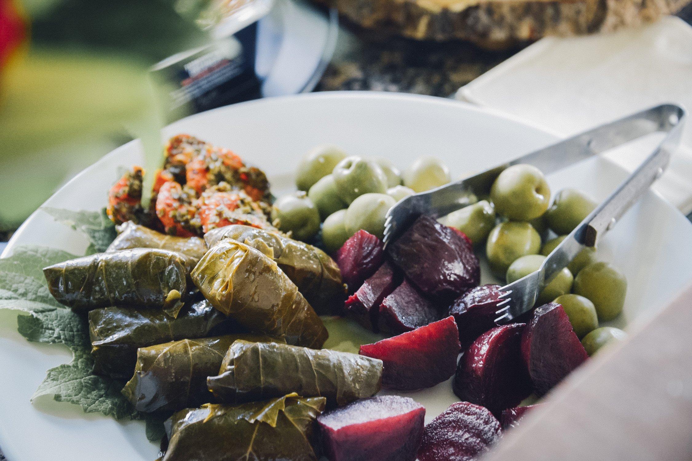 mediterranean platter with dolmas and picked vegetables and falafel  