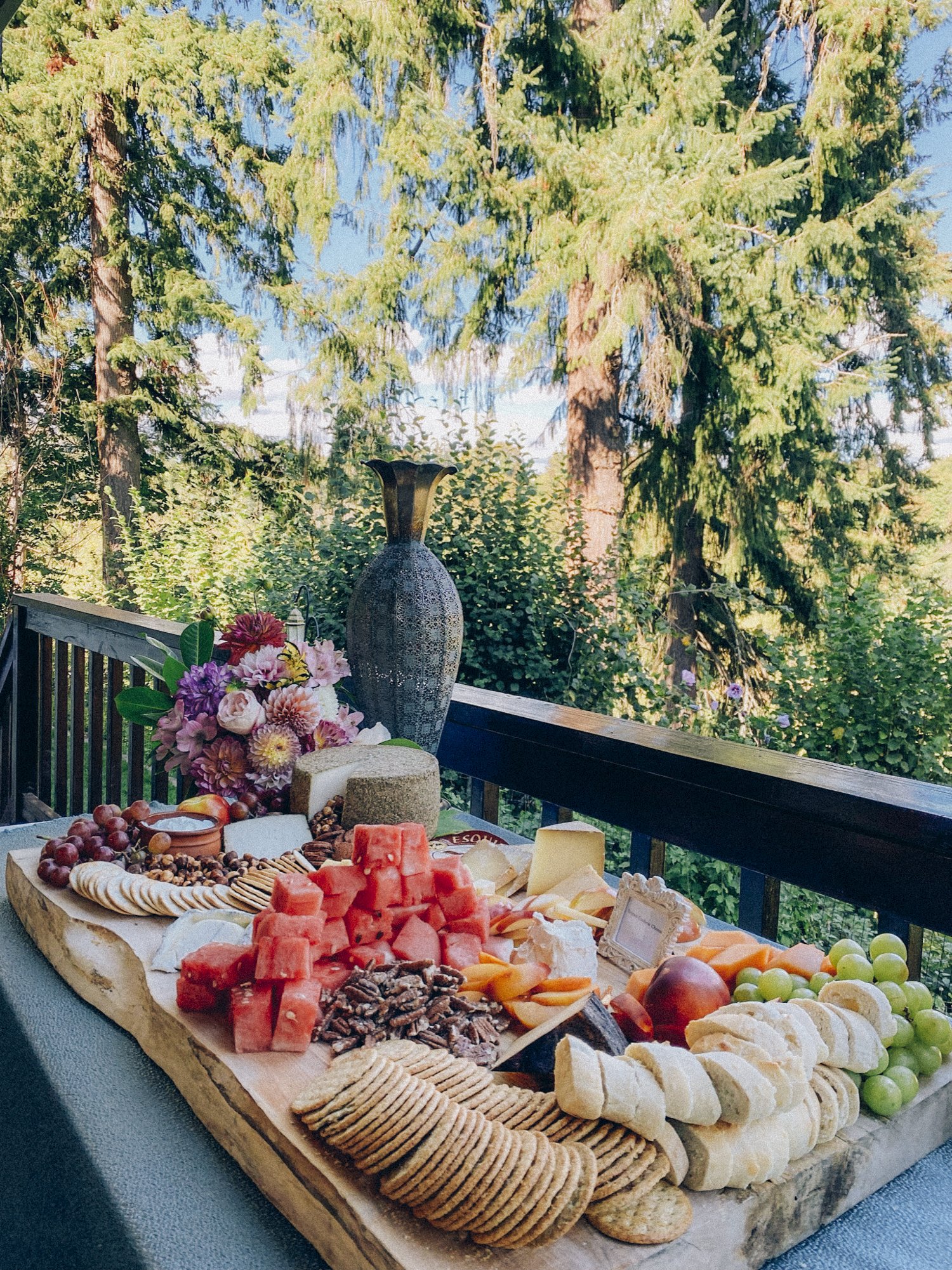 grazing board full of olives charcuterie cheeses fruits and nuts for wedding in oregon