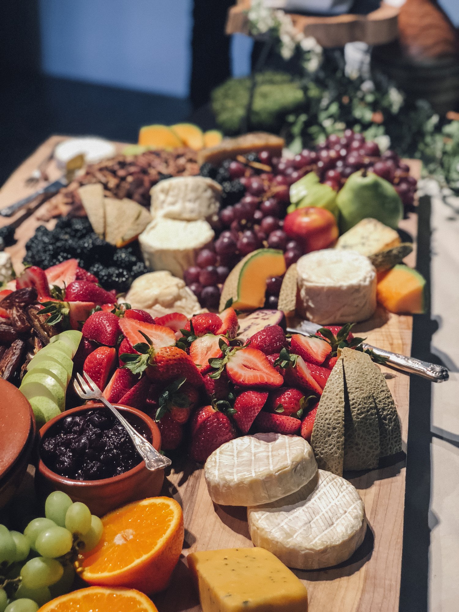 grazing board full of olives charcuterie cheeses fruits and nuts for wedding in oregon