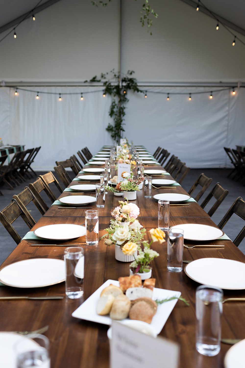 long table settings with spring style bouquets at outdoor wedding in portland oregon