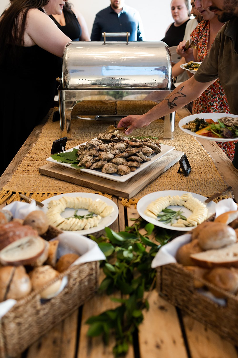 buffet style wedding catering featuring local artisan bread vegetables and pasta 