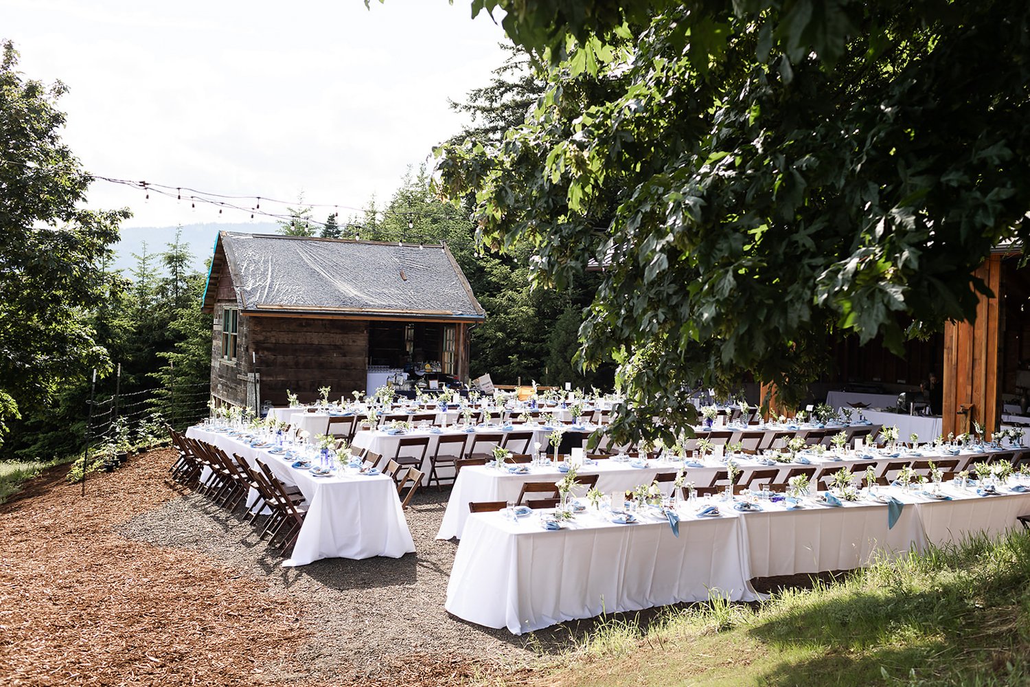 farm style outdoor wedding table setting for up to 100 people in oregon