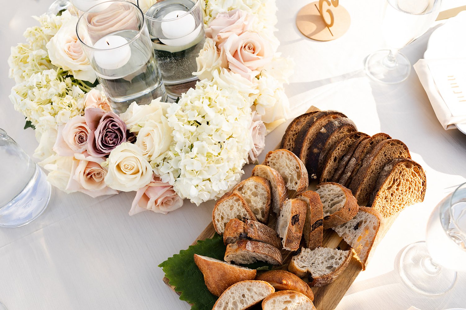 assortment of sliced artisan breads displayed on table at wedding