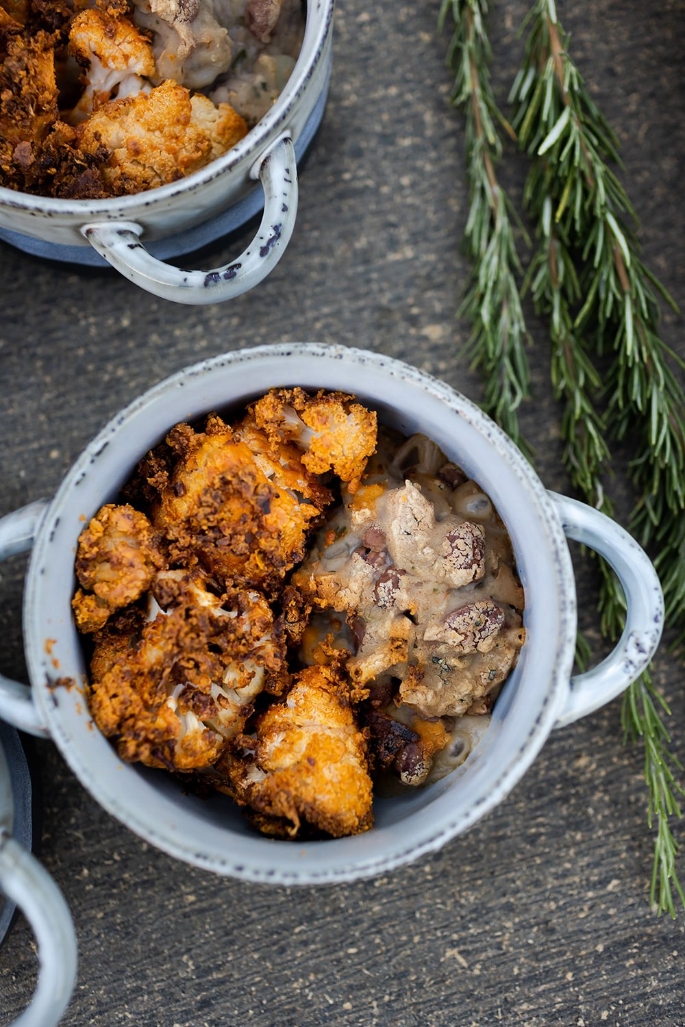 roasted cauliflower in ceramic serving bowls at wedding