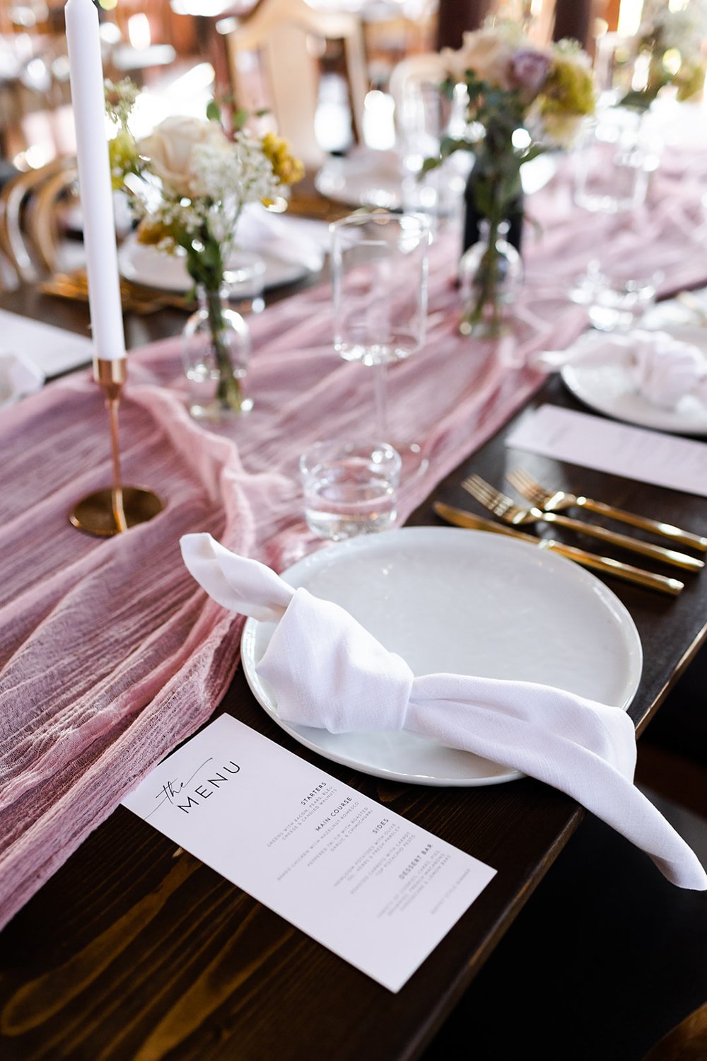 pink and white wedding table settings with gold accents and menu by art de cuisine