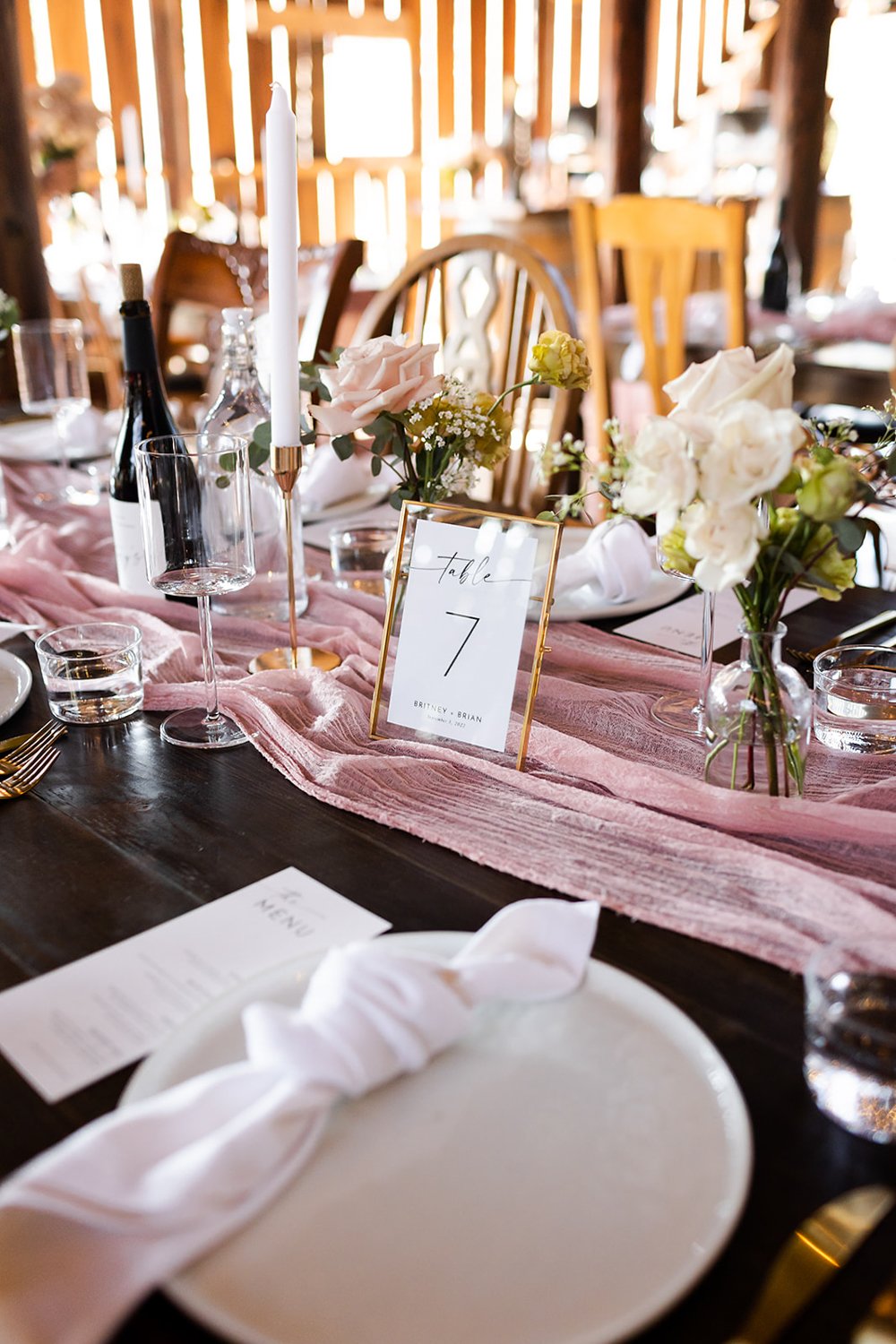 pink white and gold table setting with spring style bouquet of flowers at farm wedding in portland