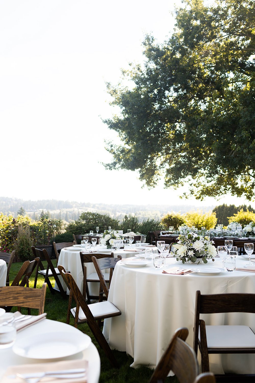 outdoor wedding tables settings with white linen in oregon