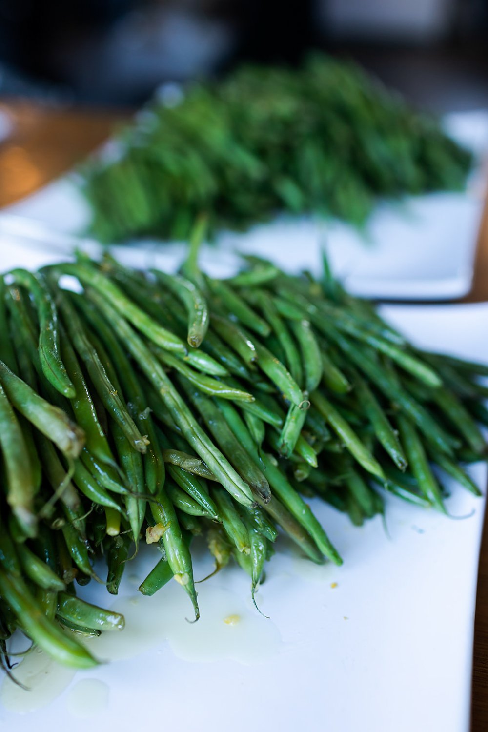 cooked green beans on plate at buffet style wedding catering event