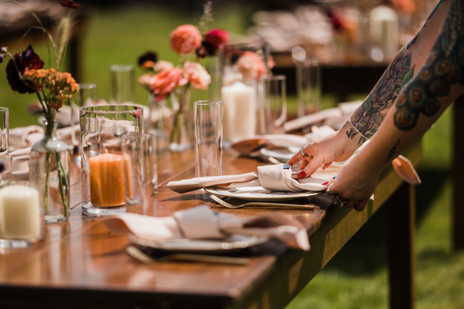 Woman creating beautiful table setting at an event in portland