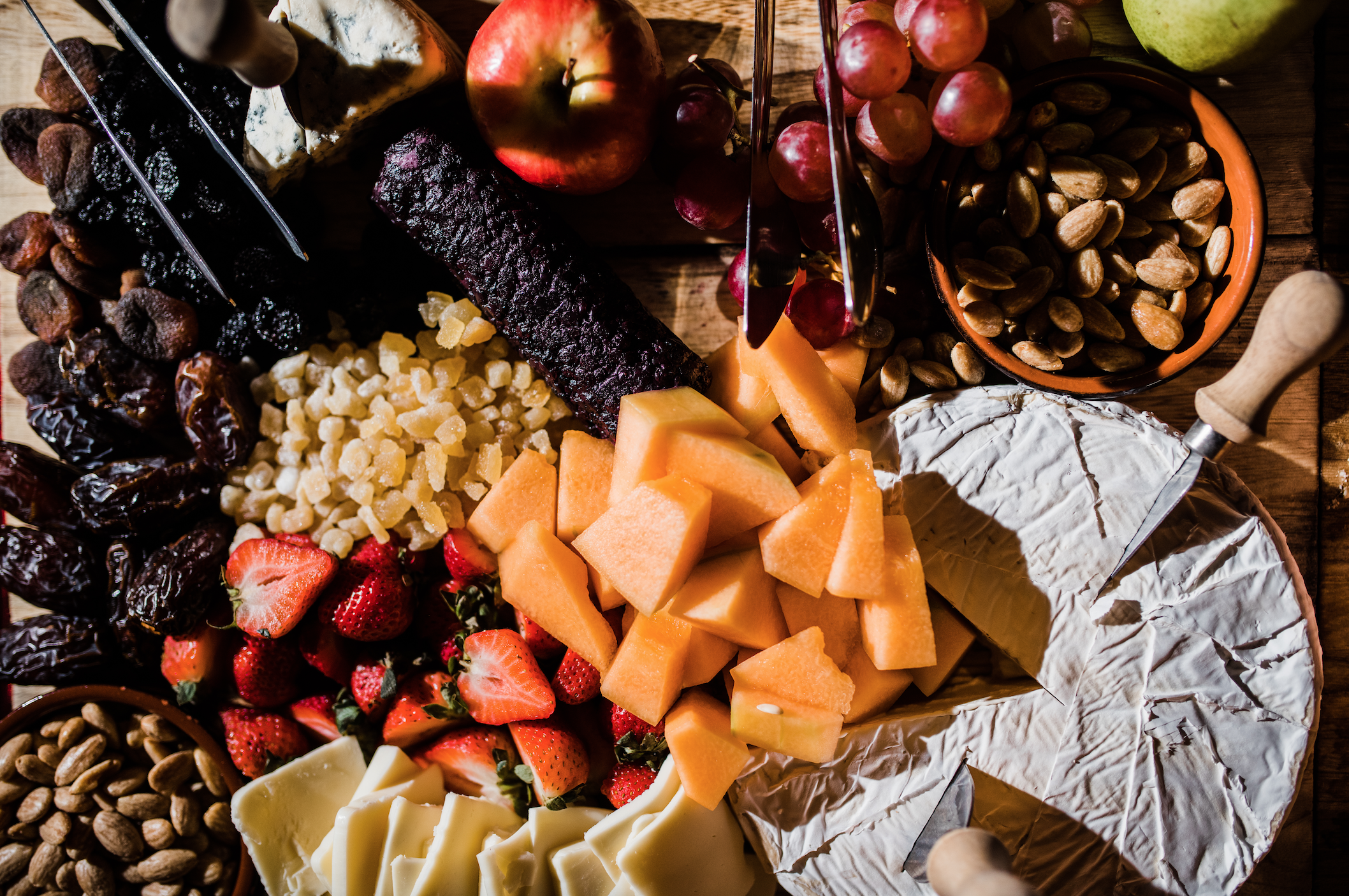 rustic cheese and charcuterie board with nuts, fresh and dried fruits for wedding appetizers