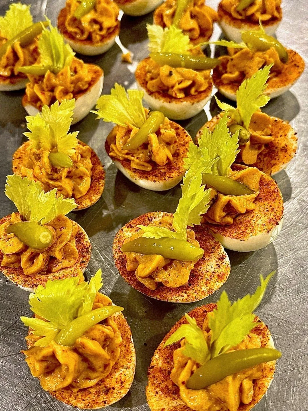 A Bloody Mary in deviled egg form: smoky, spicy, and topped with all the good stuff!

Ours get a kick from smoked paprika and a dash of hot sauce. Try finishing yours with a celery leaf or a pickle chip on top for that Bloody Mary magic. 🥚