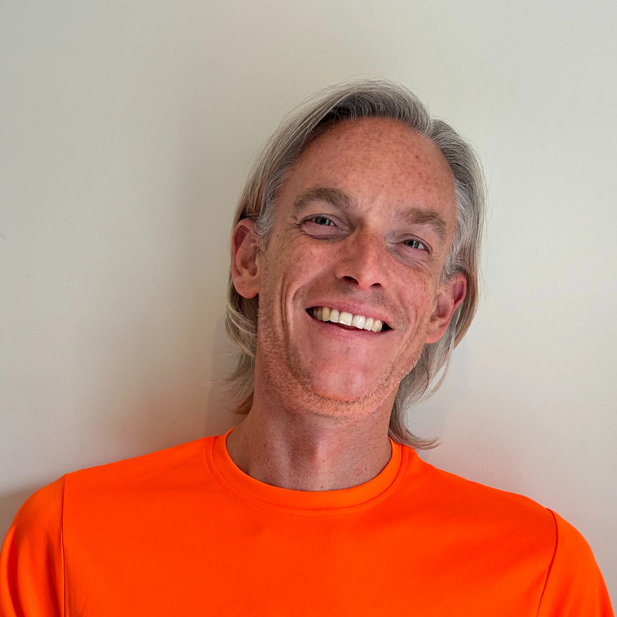 Man in orange T-shirt