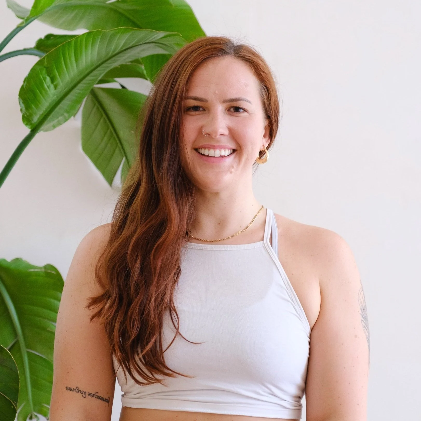 Woman in white yoga vest