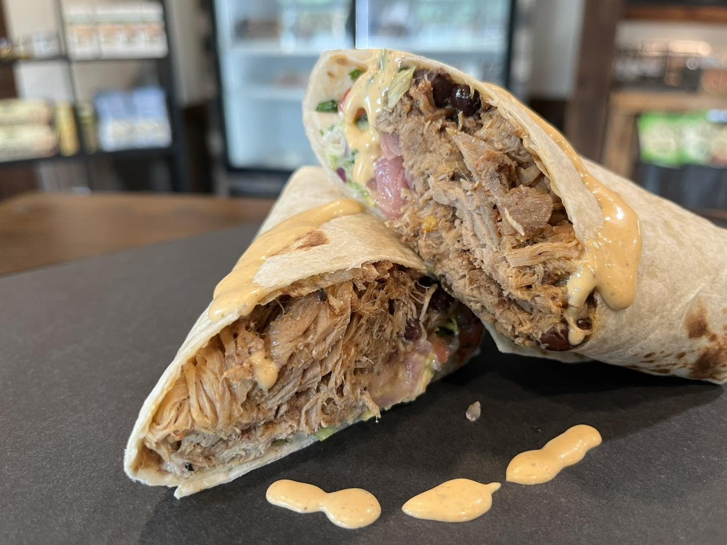 Porritto
Pulled pork, black beans, refried beans, rice, pico, quac,lettuce, cheese, pickled onions and sour cream!  What??? #lunch #grill #eatlocal