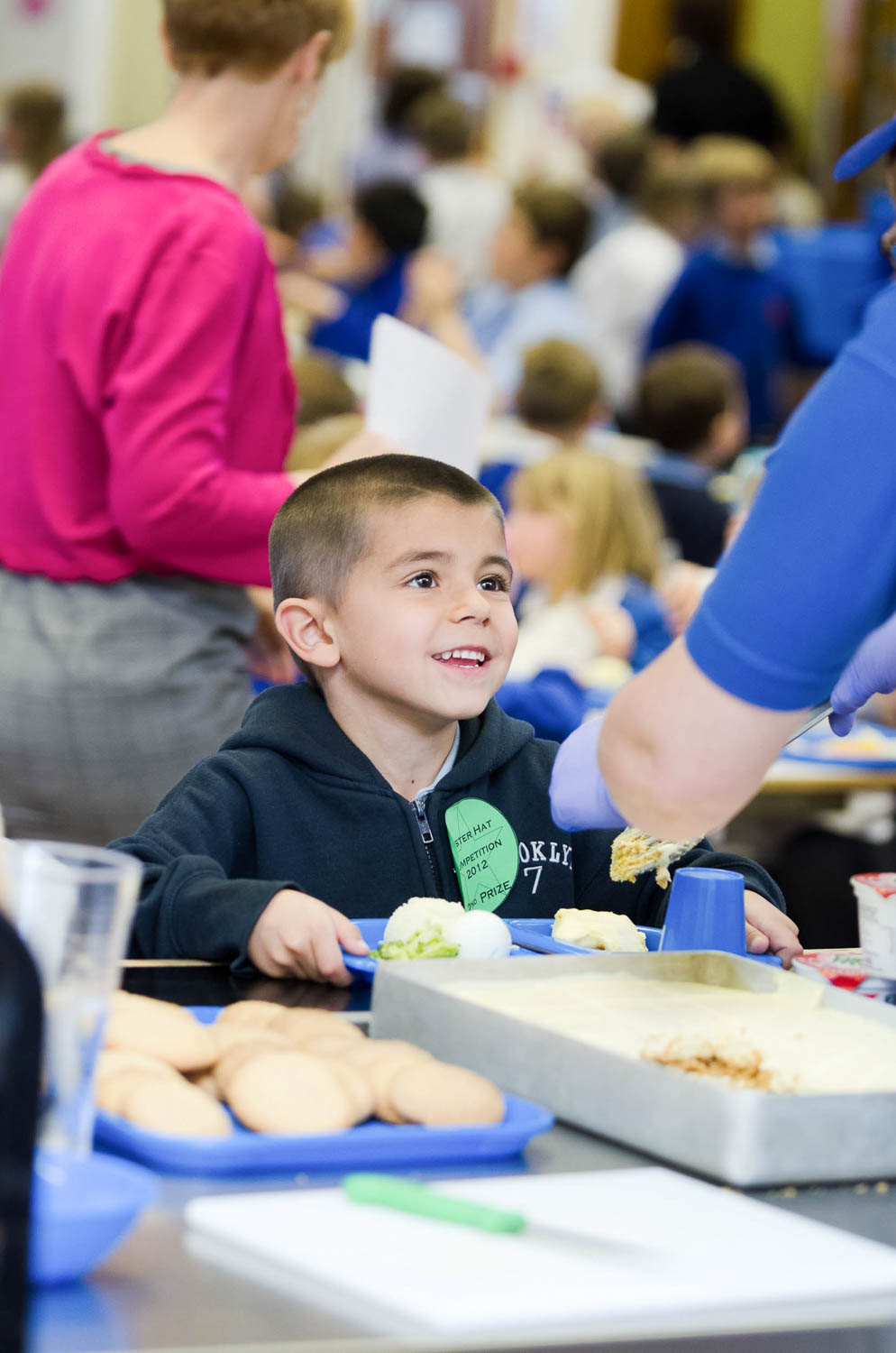 School boy being served lunch