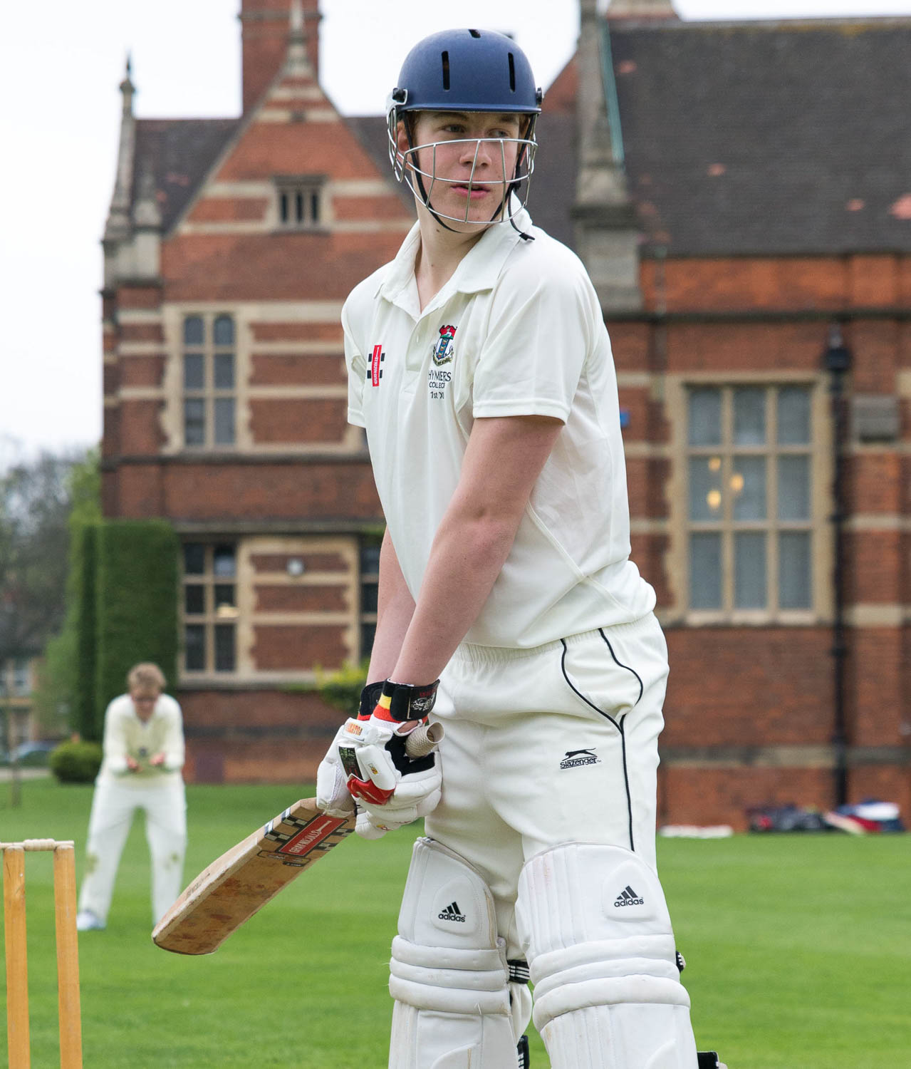 School cricket player at crease