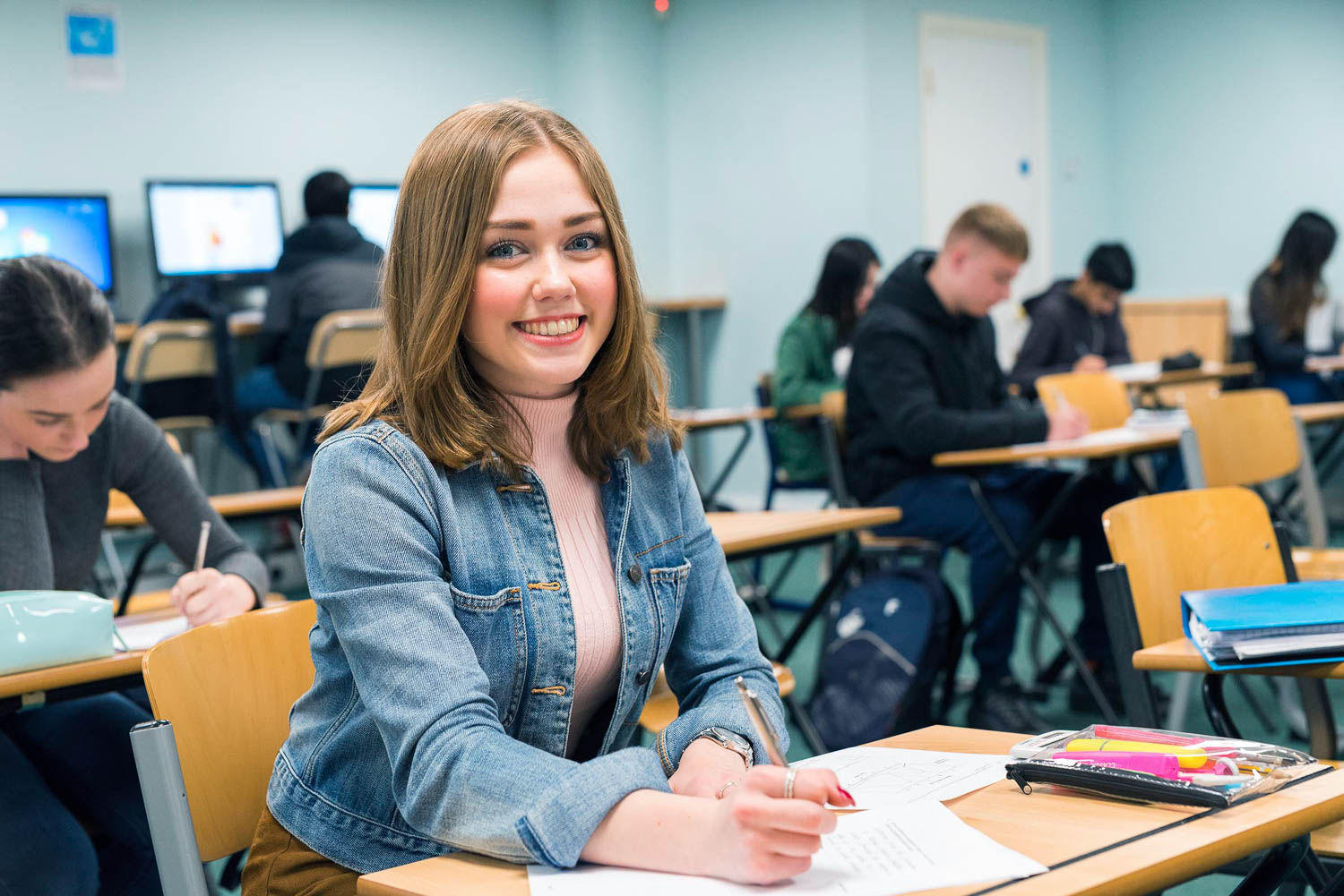 Smiling student in class