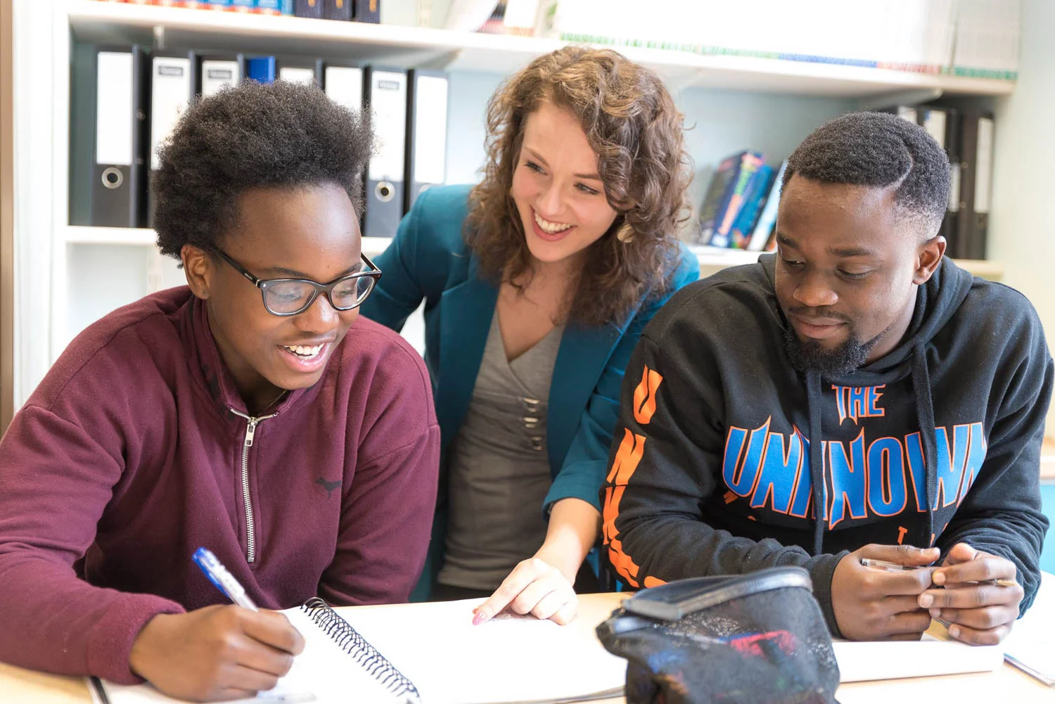 Smiling teacher with students